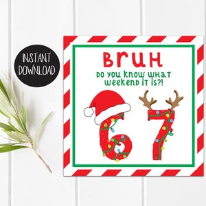 May include: A square Christmas-themed digital print with red and green accents. The numbers "6" and "7" are decorated with Christmas lights and reindeer antlers. The text "BRUH do you know what weekend it is?!" is displayed in red.
