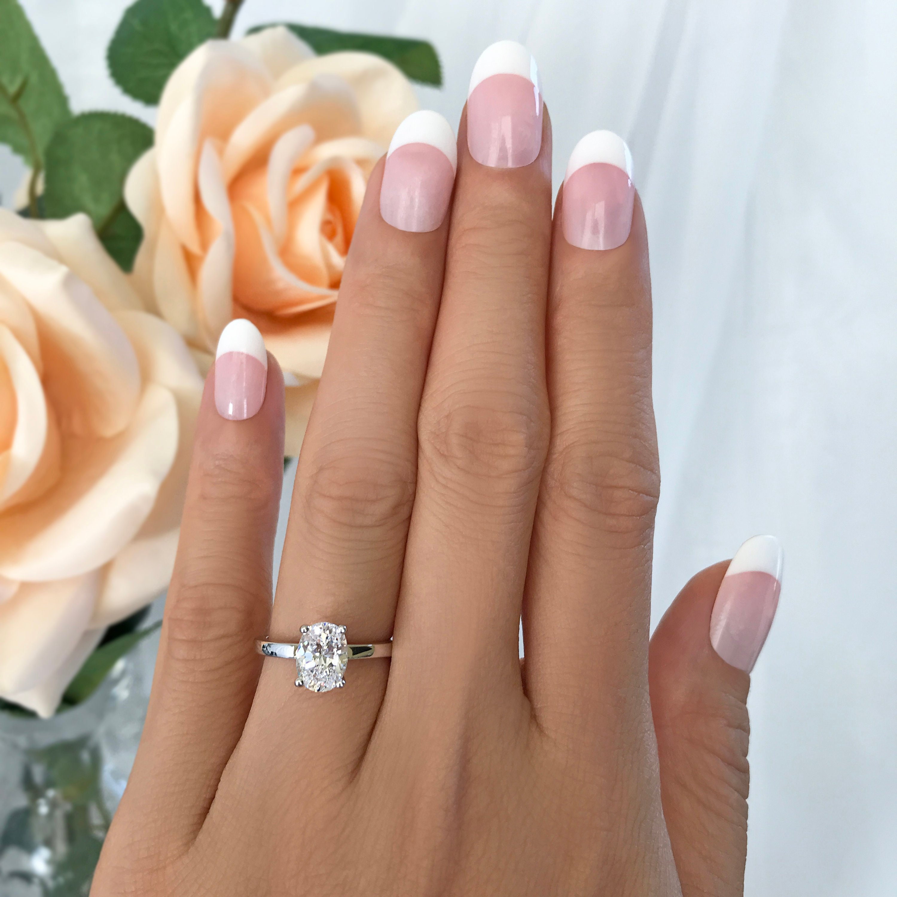 1.2 carat oval diamond ring on hand ISAC iScholar