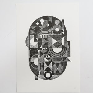 May include: Black and white geometric abstract print with a circular design. The print features a variety of shapes, including circles, squares, triangles, and rectangles.