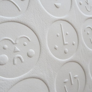 Faces Embossed Linocut print