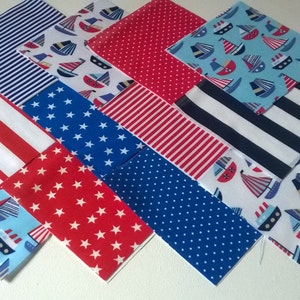 May include: A collection of 10 fabric squares with different patterns, including red and white stripes, blue and white stripes, red stars on a blue background, blue stars on a red background, blue polka dots on a white background, and a blue and white sailboat pattern.