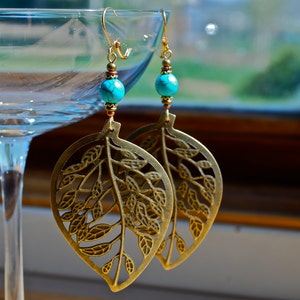 Antique, bronze  leaf earrings. Gold, silver, copper accents with a turquoise stone. Great gift and lightweight.