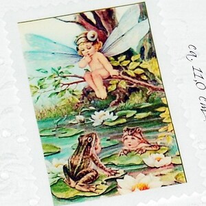 Enchanting patch appliques, frog, elf, fairy in a water lily pond