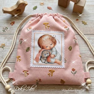 Cute patch of a girl with a kitten - vintage-style patch applique for clothing, bags, and patchwork.