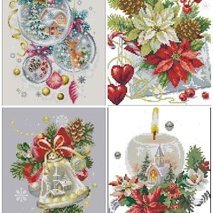 May include: A collection of four cross-stitch designs featuring Christmas ornaments and festive elements. The designs include snow-covered houses, deer, bells, poinsettias, and decorative baubles in a variety of colors, including red, green, and gold.