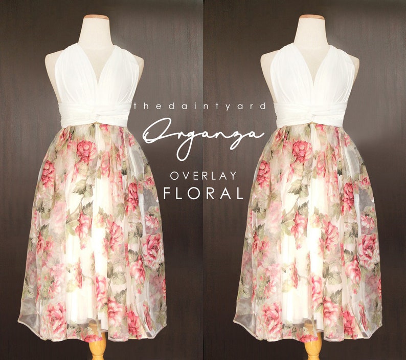 May include: White halter top with a floral print overlay skirt. The skirt is a sheer fabric with a white background and pink and green floral pattern. The text "the dainty yard Organza OVERLAY FLORAL" is visible on the image.
