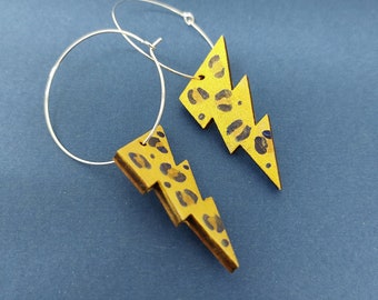 Gold leopard lightning bolt hoop earrings in painted wood