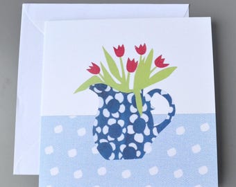 Jug of tulip flowers blank card