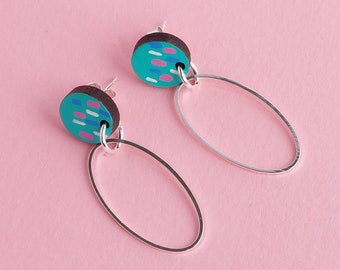 Colourful earrings with dangly silver oval