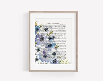 May include: A framed print with a watercolor painting of blue flowers on a vintage hymn sheet. The hymn sheet features the lyrics and sheet music for the song "Great Is Thy Faithfulness".