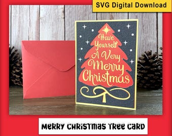 Può includere: Un biglietto di Natale con una busta rossa. Il biglietto presenta un albero di Natale rosso con la scritta "Have Yourself A Very Merry Christmas" in un carattere decorativo. Lo sfondo è nero con stelle bianche.