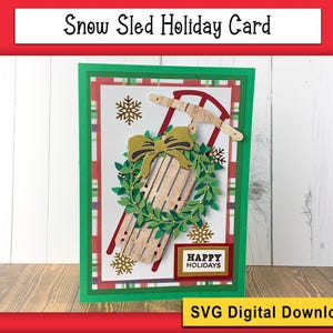 May include: A green, red, and white holiday card with a wooden sled, a wreath, and the text "Happy Holidays".