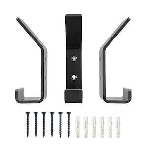 May include: Three black metal hooks with two screw holes each. The hooks are designed to be mounted on a wall. The package includes six black screws and six white plastic wall plugs.