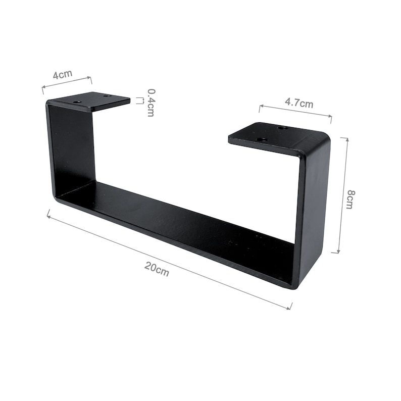 Peut inclure: Un pied de table en m&eacute;tal noir en forme de U rectangulaire. La jambe mesure 20 cm de long, 8 cm de haut et 4,7 cm de large. La plaque sup&eacute;rieure mesure 4 cm de large et 0,4 cm d'&eacute;paisseur. Le pied a des trous pr&eacute;-perc&eacute;s pour le montage.