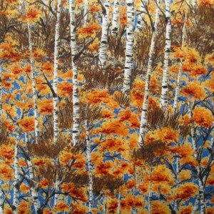 May include: A fabric pattern featuring a white birch tree forest with orange and yellow leaves on a blue background.
