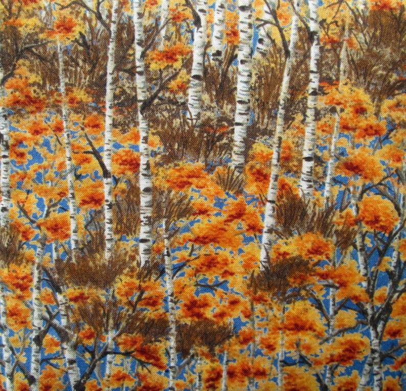 May include: A fabric pattern featuring a white birch tree forest with orange and yellow leaves on a blue background.