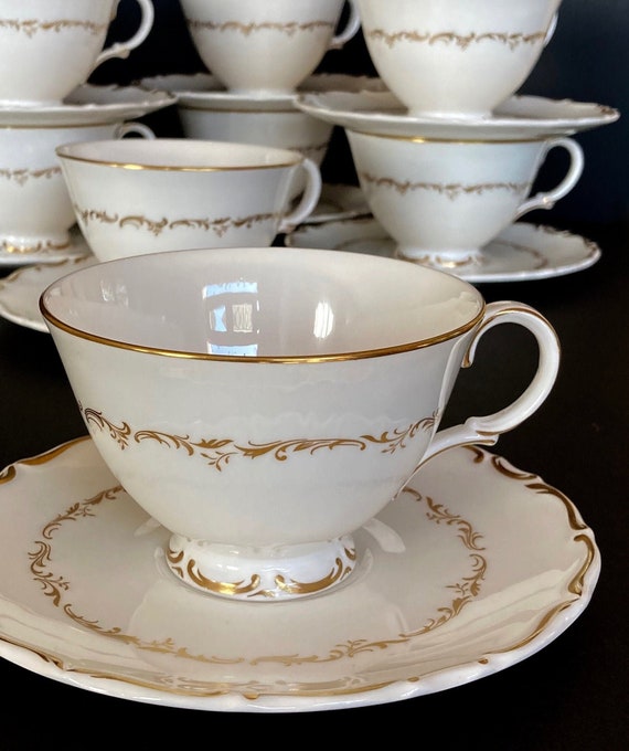 Vintage Gold Trimmed Tea Cups and Saucers with Scalloped Edges Vintage Gold Trimmed Tea Cups and Saucers with Scalloped Edges