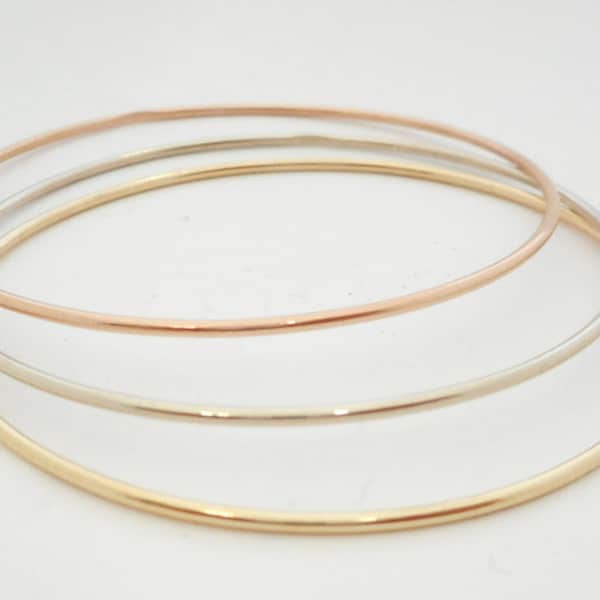 14 K. Solid Gold(Not Hollow) 1.50 mm. Round Wire (4 to 5.5 grams)  Stacking Bangle Bracelet