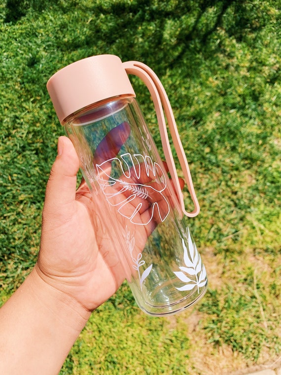Double wall pink Glass water bottle.