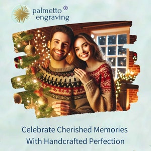 May include: A couple smiles in front of a Christmas tree, wearing festive sweaters. The image includes the text "Celebrate Cherished Memories With Handcrafted Perfection" and the Palmetto Engraving logo.