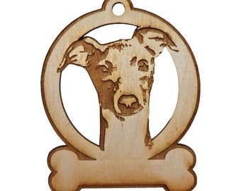 May include: A wooden ornament featuring a dog's head in a circle with a bone shape at the bottom. The ornament is light brown in color.