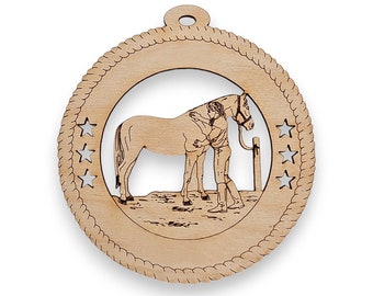 May include: A wooden ornament featuring a girl hugging a horse. The ornament is round and has a rope-like border. There are five stars cut out around the edge of the ornament.