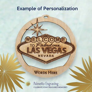 May include: A laser-cut wooden ornament featuring the iconic "Welcome to Fabulous Las Vegas" sign. The ornament includes the text "WORDS HERE" and "Example of Personalization". The design incorporates a star and a circular frame, with a hole for hanging.