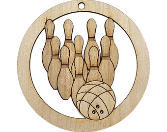 May include: A wooden ornament shaped like a circle with a bowling ball and ten bowling pins inside. The ornament is made of light brown wood and has a hole at the top for hanging.