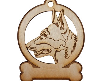 May include: Wooden ornament featuring a German Shepherd dog head silhouette in a circle with a bone shape at the bottom. The ornament is unfinished and ready to be painted or stained.