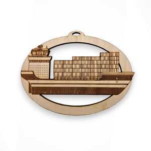 May include: A wooden ornament shaped like a container ship with a brown wood finish. The ship is carrying cargo containers.