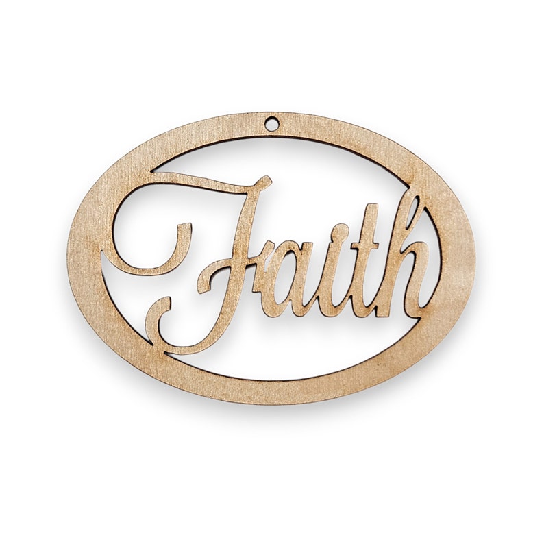 May include: A wooden oval ornament with the word "Faith" cut out in a cursive font.