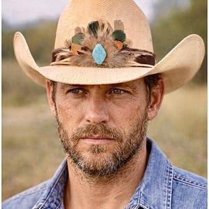 May include: A straw cowboy hat with a decorative band featuring feathers and a turquoise-colored stone. The hat has a wide brim and a classic western design, suitable for outdoor wear.