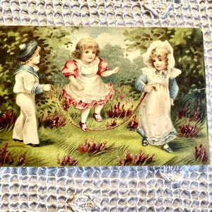 Darling Antique Children Jumping Rope Boy in Sailor Suit Girls in Frilly Dress Hand Colored Printed in Germany 1910 Divided Post Card
