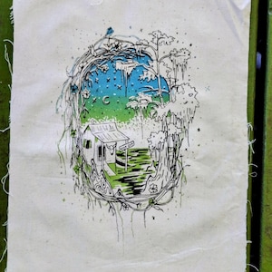 May include: A rectangular piece of off-white fabric featuring a black ink illustration of a small cabin in a swampy landscape. The scene is framed by tangled vines and trees, with a blue and green gradient sky, a crescent moon, and a sign reading KEEP OUT.