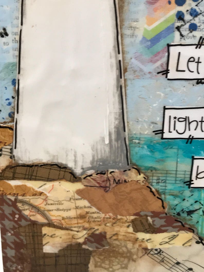 May include: A mixed media art piece with a white background and a map of the United States. The art piece has a quote that says "Let your light shine".
