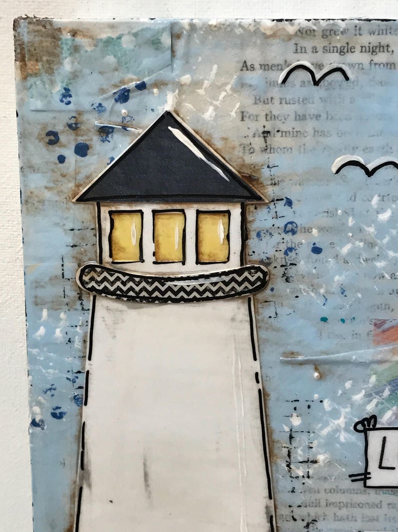 May include: A mixed media art piece featuring a lighthouse with a black roof, yellow windows, and a chevron-patterned balcony. The lighthouse is set against a textured blue and white background with printed text and hand-drawn bird silhouettes.