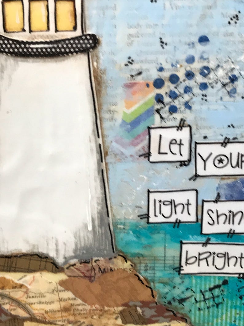 May include: A white lighthouse with a black and white striped roof and yellow windows. The lighthouse is painted on a background with a rainbow, blue circles, and the words "Let your light shine bright".