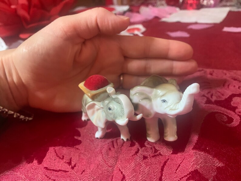 unique find! One is a pin cushion Enesco sticker on bottom of one Vintage elephant figurines