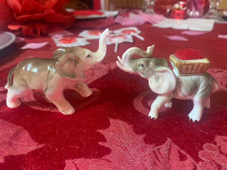 unique find! One is a pin cushion Enesco sticker on bottom of one Vintage elephant figurines