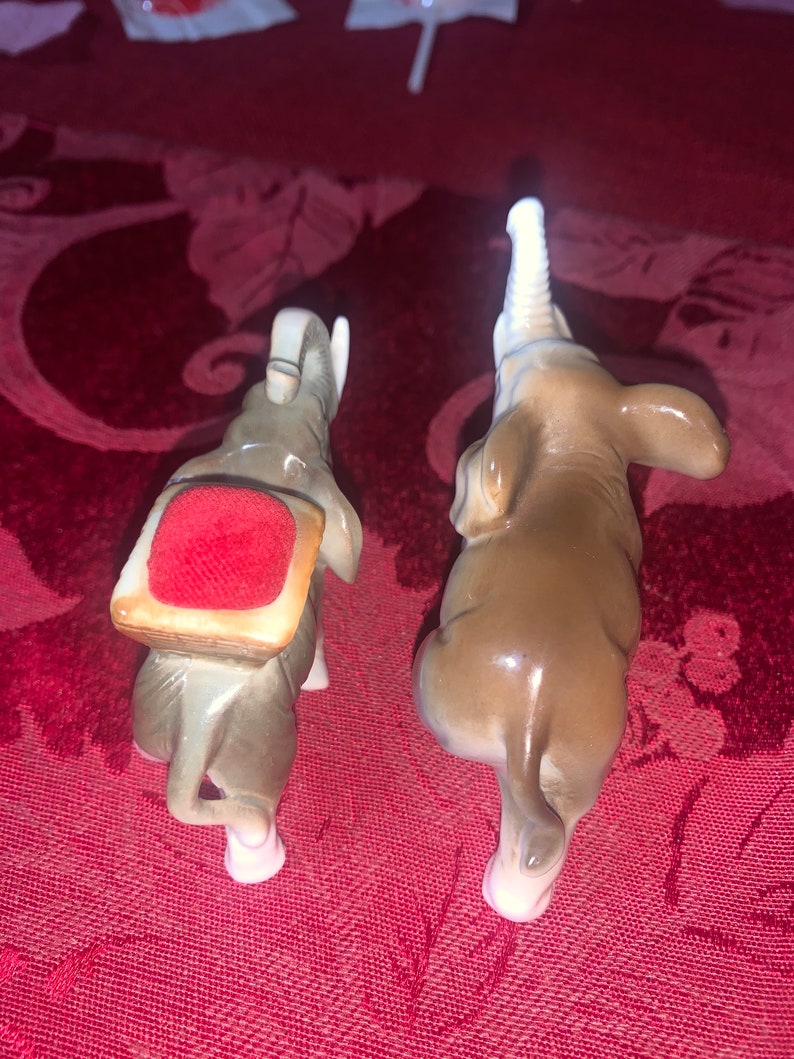 unique find! One is a pin cushion Enesco sticker on bottom of one Vintage elephant figurines