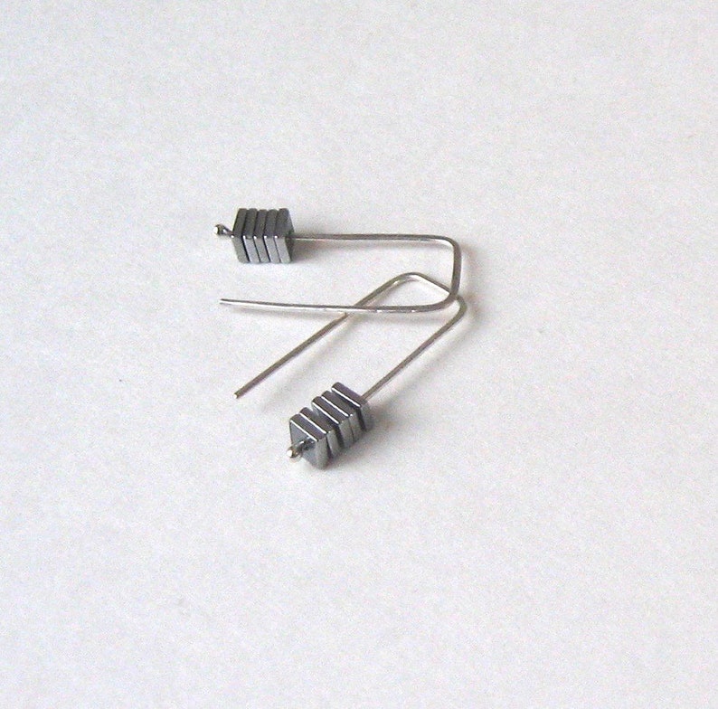 Staple silver earrings with metal coated hematite squares