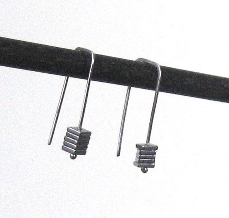 Staple silver earrings with metal coated hematite squares