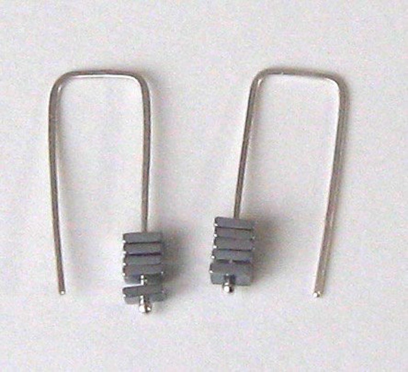 Staple silver earrings with metal coated hematite squares