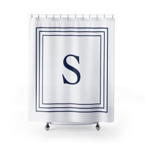 May include: White shower curtain with a navy blue border and a large navy blue letter "S" in the center.