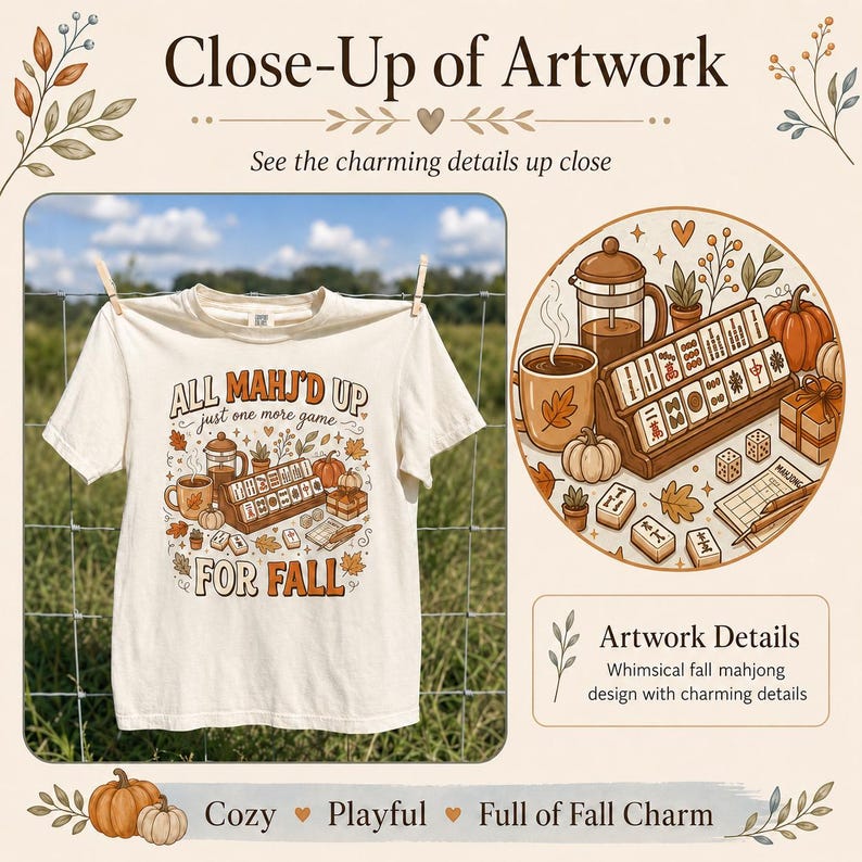 May include: A cream-colored t-shirt featuring a graphic print with the text ALL MAHJ'D UP just one more game FOR FALL. The illustration includes a mahjong set, a coffee mug, a French press, pumpkins, and autumn leaves in shades of orange and brown.