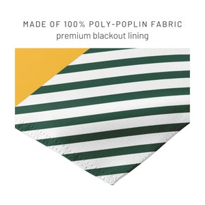 May include: Close-up of a fabric sample with a green and white striped pattern. The sample is made of 100% poly-poplin fabric with a premium blackout lining. A yellow triangle is in the upper left corner.