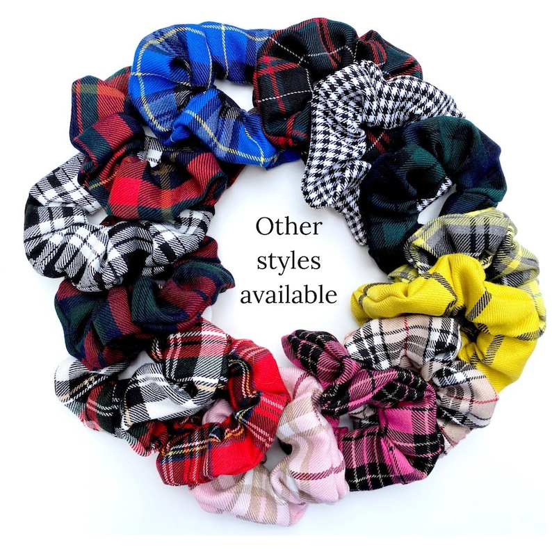 May include: A collection of colorful plaid scrunchies in various patterns, including red, black, white, blue, green, yellow, and pink. The text "Other styles available" is written in the center of the image.