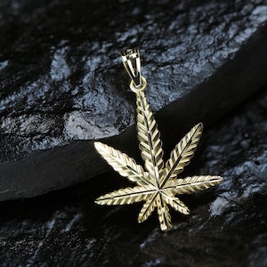 Gold Marijuana Leaf pendant made with 10 karat yellow gold