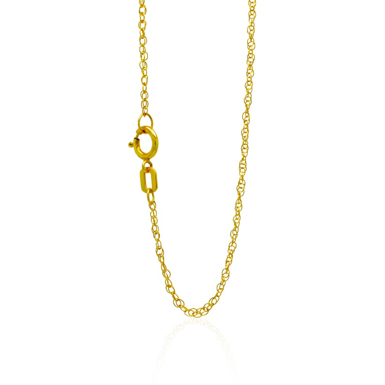 May include: A gold chain necklace with a lobster clasp.
