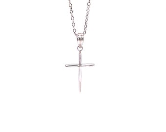 May include: A silver chain necklace with a simple silver cross pendant.